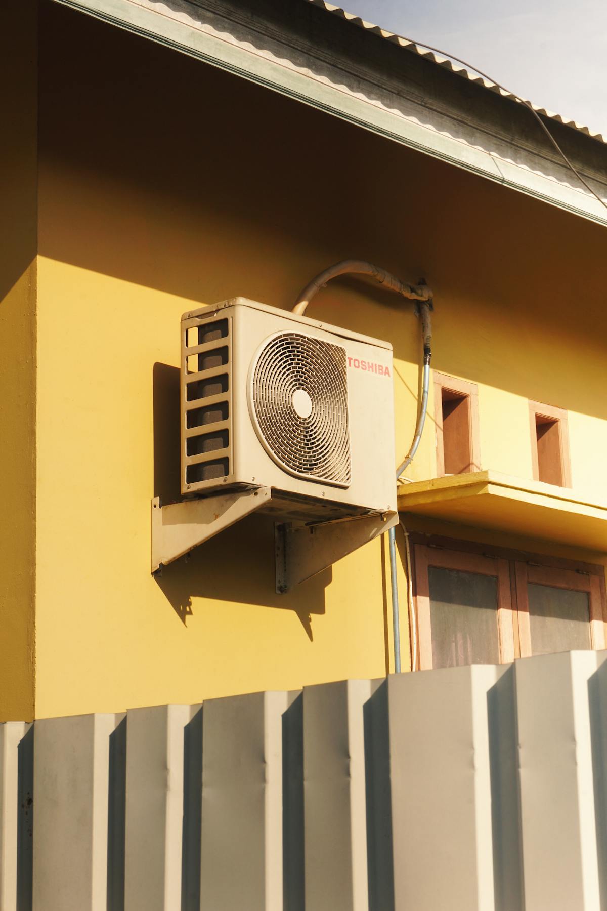 Heat pump and HVAC system on a building wall