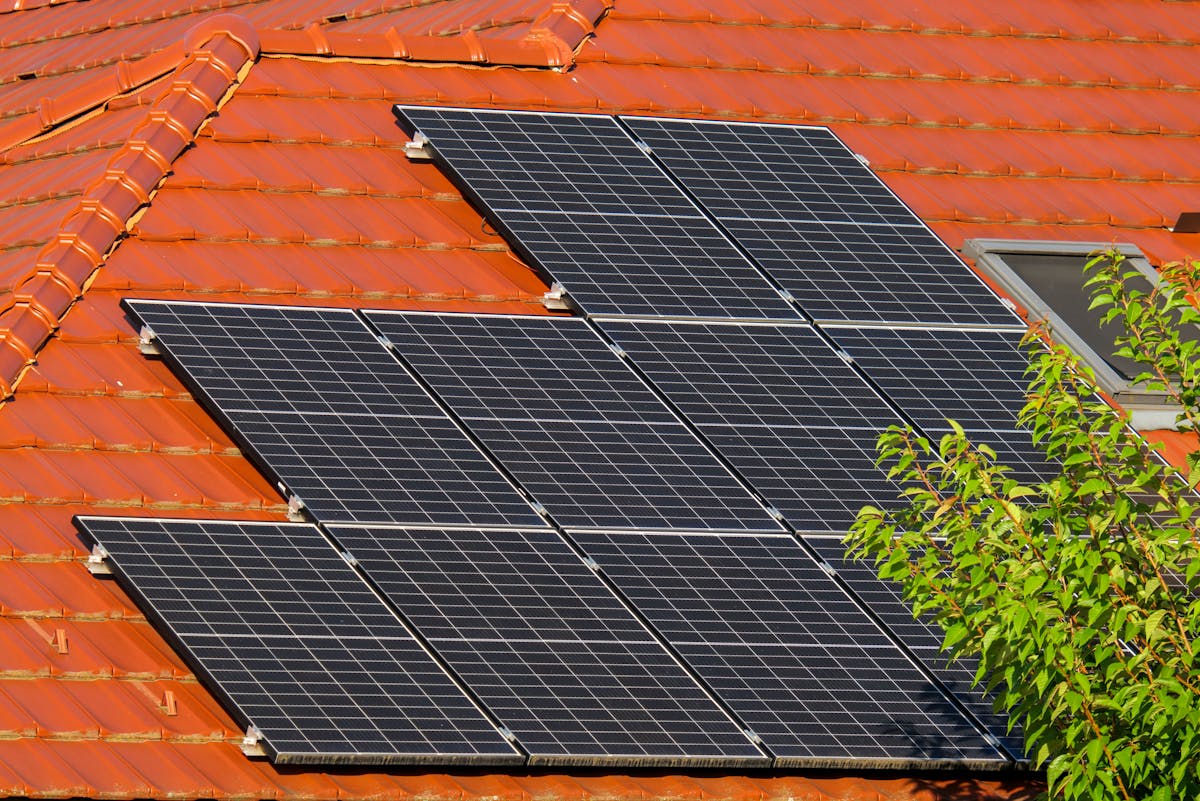Close-up of solar panels installed on roof tiles