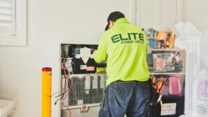 Technician installing a home battery storage system