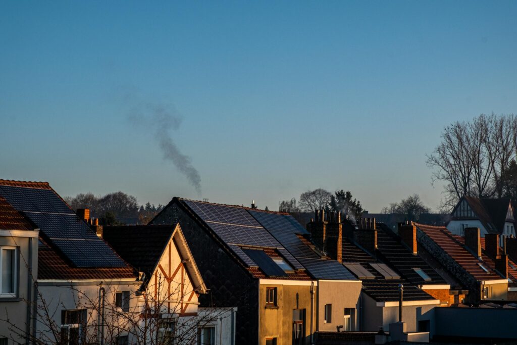 Row of UK houses with solar panels on rooftops