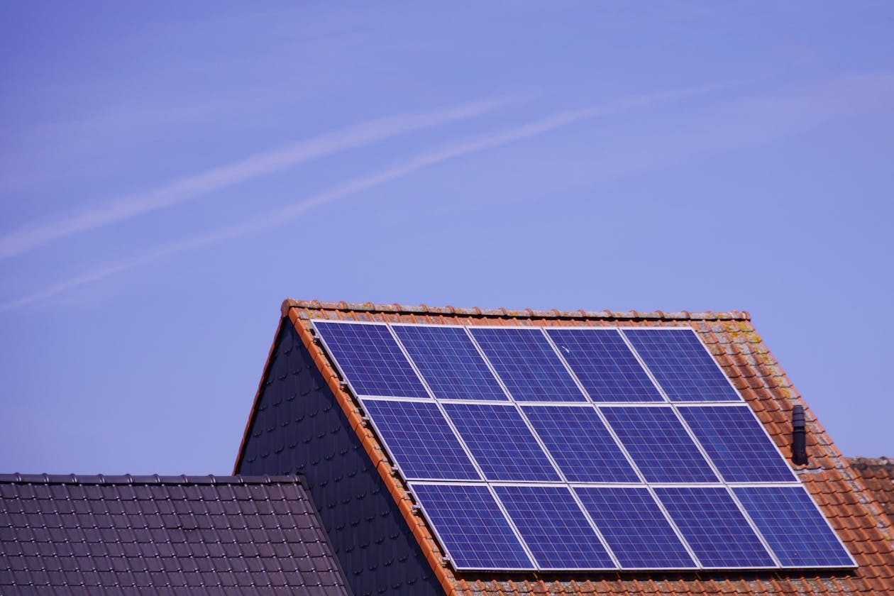 Solar panels generating clean energy on a house roof